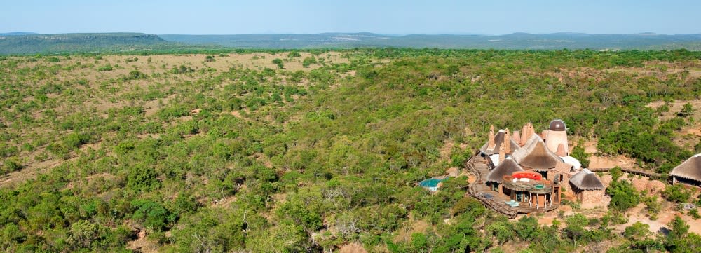 "Private playground." A short walk away from the lodge are 9 guest chalets which can be used by friends or as staff accommodation while you're in residence. Created using the signature form, textures and colours of Africa both inside and out, the circular design of the lodge perfectly reflects a traditional South African settlement centred around a kraal. Rented on an exclusive basis only, Leobo's concept is to offer guests absolute privacy so the entire reserve will be your private playground for the duration of your stay. "Dedicated and highly-skilled staff" Whether you're planning a trip with the family or travelling with a group of friends, Leobo caters for all ages and interests. The dedicated and highly-skilled staff are as discreet as they are charming and will ensure that every member of your party fully enjoys their stay on the reserve. Leobo's private chef will be at your disposal to prepare delicious meals throughout the day and one of the highlights of the holiday will undoubtedly be sharing a homemade pizza served directly from the wood oven on the viewing deck above a lake. As the sun sinks over the horizon, watch the reserves hippo families swim and graze just below you, this is definitely not your average vacation.